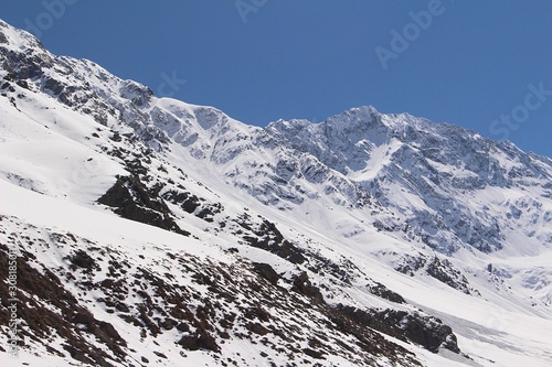 High peaks of snowy mountains in Caj  n del Maipo  in the central Andes of Chile.