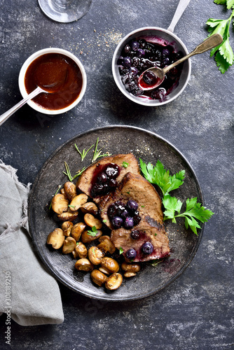Slow cooked beef with mushrooms and blueberry sauce