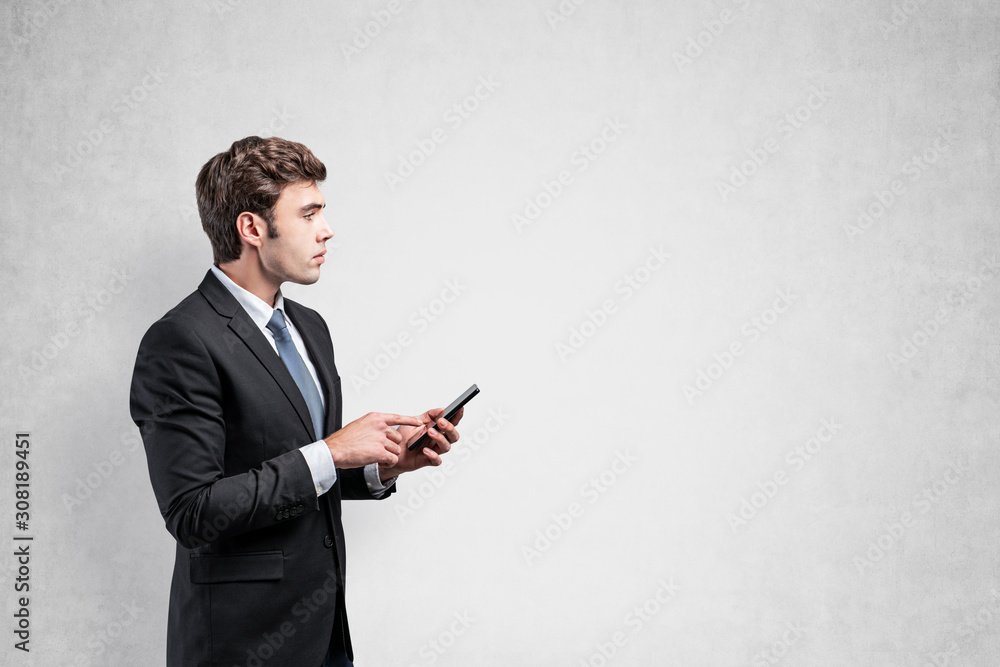 Serious businessman using smartphone, mock up