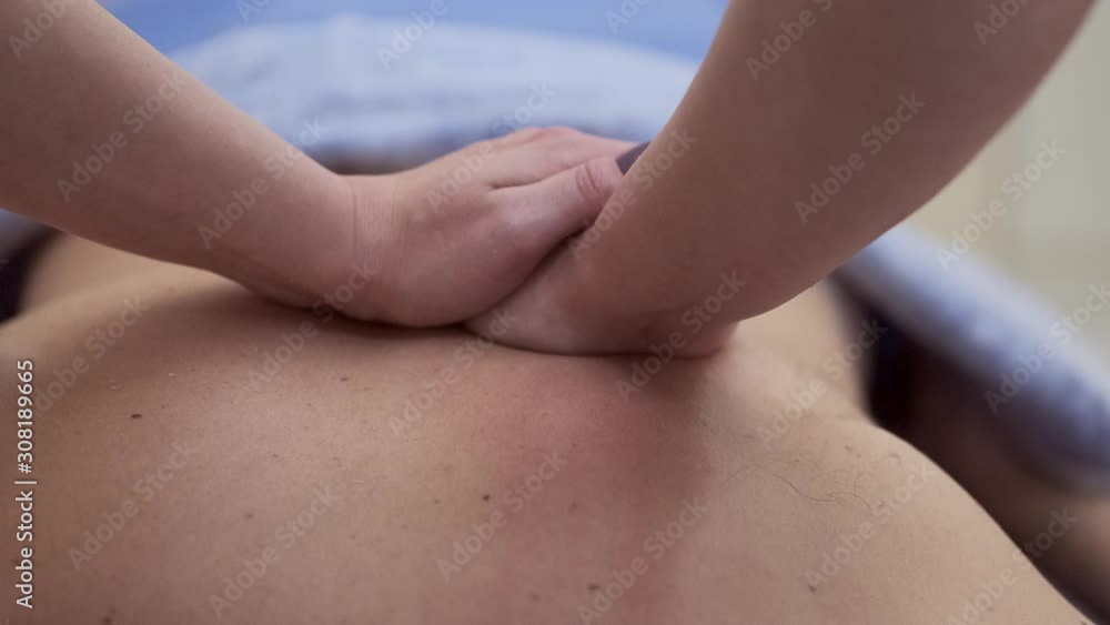professional masseuse massaging a male client. Man receiving full body massage at spa relaxing rest wellness resort wellbeing pampering enjoying occupation service. Tourism industry 4k 50 fps slow mot professional masseuse massaging a male client. Man receiving full body massage at spa relaxing rest wellness resort wellbeing pampering enjoying occupation service. Tourism industry 4k 50 fps slow mot