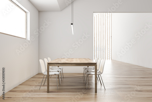 Attic white dining room with long table