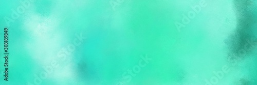 old color brushed vintage texture with turquoise, pale turquoise and aqua marine colors. distressed old textured background with space for text or image. can be used as header or banner