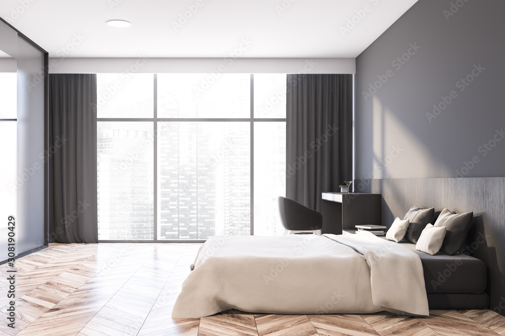 Fototapeta premium Side view of gray master bedroom with armchair