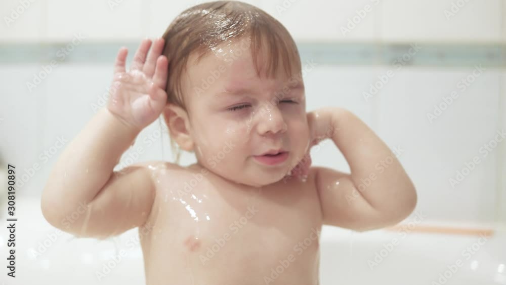 Infant boy doused with water