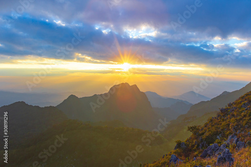 Sunset or evening time with blue sky and sunray or sunbeam at Doi Luang Chiang Dao, Chaingmai, Thailand. © Phongsak