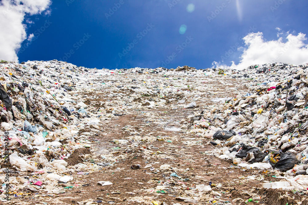 garbage dump pile in trash dump or landfill,truck is dumping the gabage