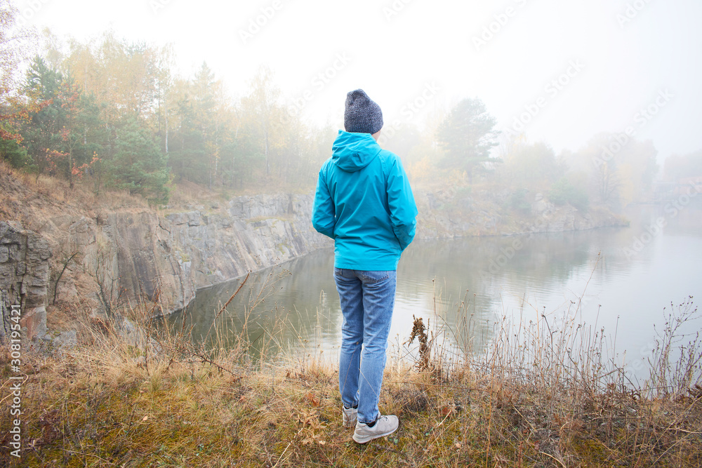 girl walks in the woods in the early autumn morning girl walks in the woods in the early autumn morning