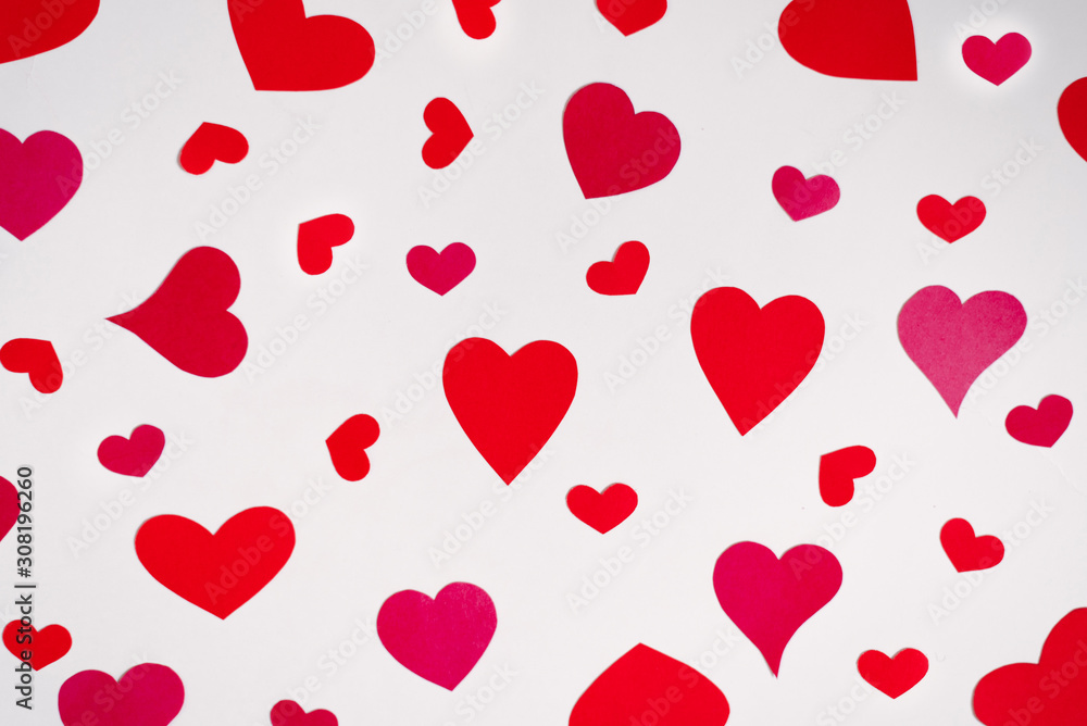 Background of red and pink hearts on white background. Valentine's day love holiday. Holiday card