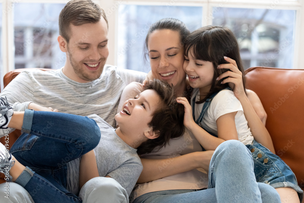 Obraz premium Happy mother and father hugging enjoying and having fun.