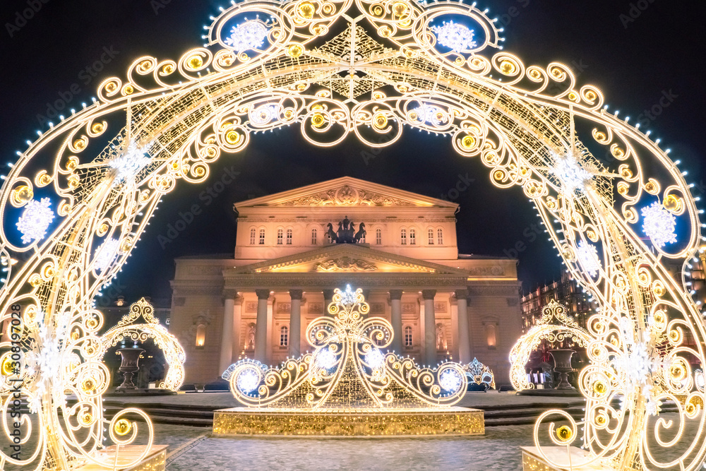 Moscow. Russia. Bolshoi theatre on the background of Christmas decorations. New Year in the capital of the Russian Federation. Festive evening in Moscow. Ornaments of luminous garlands.