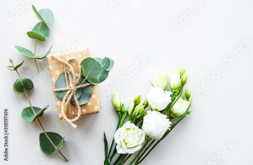 White eustoma flowers and gift box