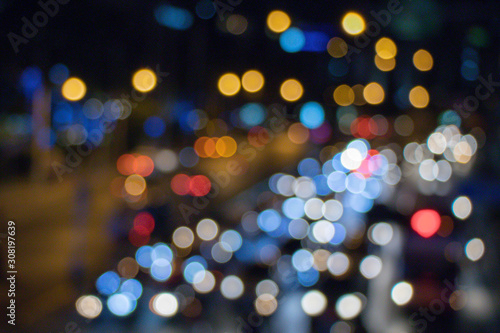 Abstract blurred colorful bokeh street lights bokeh for background.Traffic lights on the street.Defocusing abstrsct background. © alohapatty