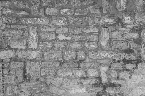 Black and white photography of old vintage brick wall. Horizontal image.