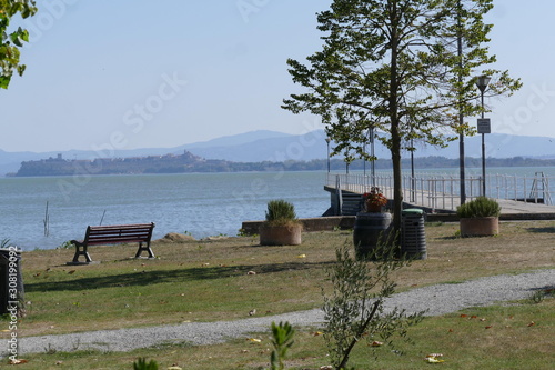 concrete pier in the lakeside of Borghetto on Trasimeno Lake.