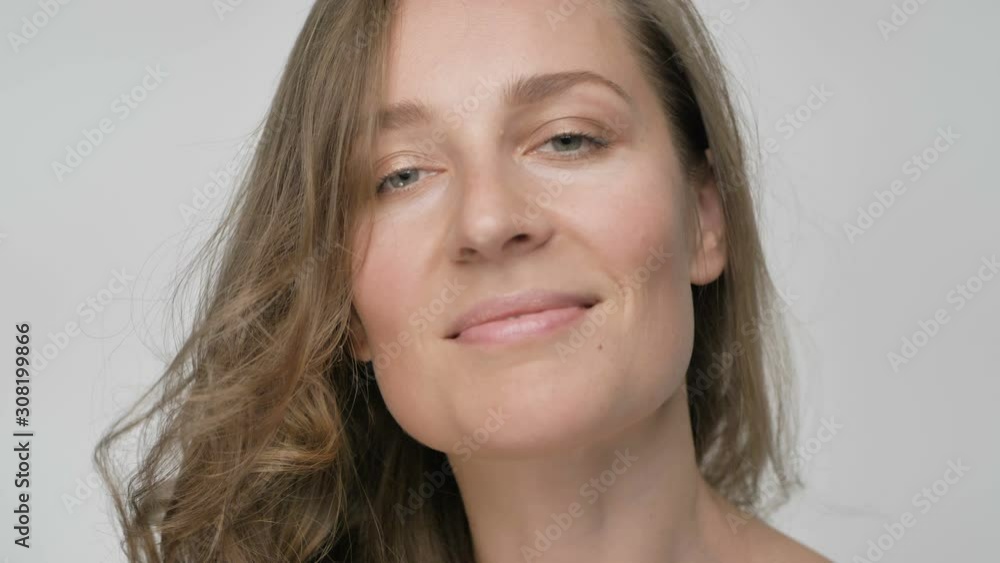 portrait of a flirting and smiling woman portrait of a flirting and smiling woman