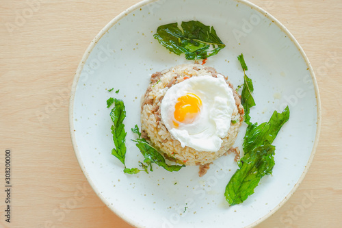 Fried rice with beef, holy basil and thai herb served with poached egg