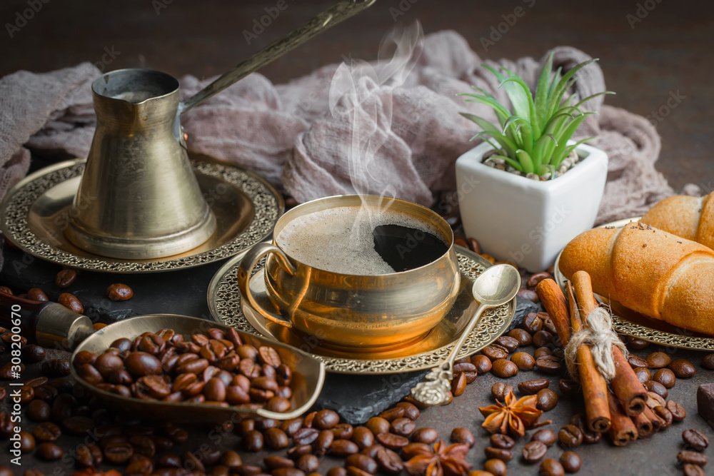 Coffee in a cup and saucer on an old background. Coffee in a cup and saucer on an old background.