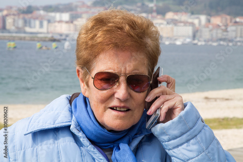 senior woman talking with mobile phone © tetxu