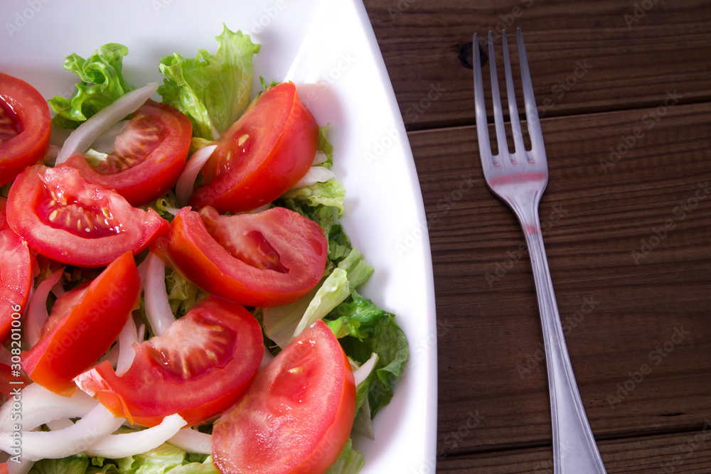 lettuce, tomato and onion salad diet and health concept