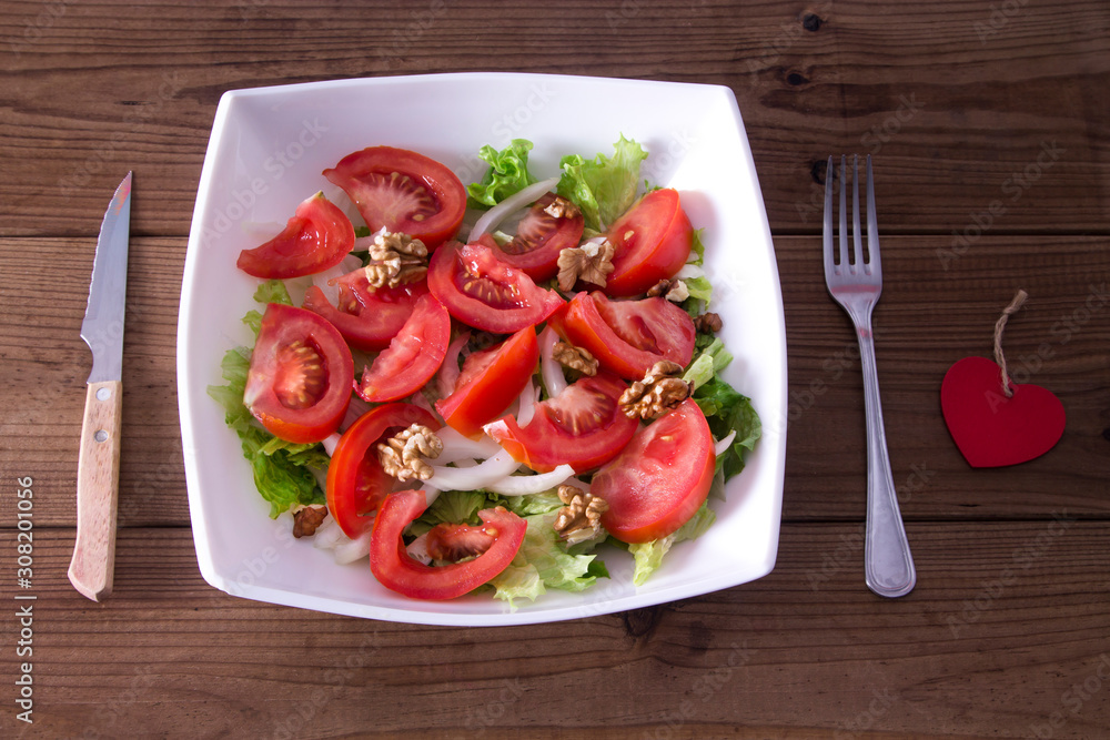 diet concept. bowl of lettuce, tomato and onion diet concept. bowl of lettuce, tomato and onion