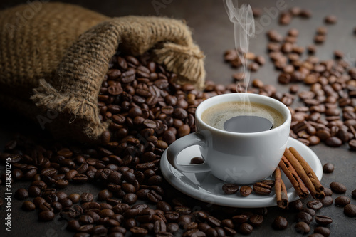 Coffee in a cup and saucer on an old background.