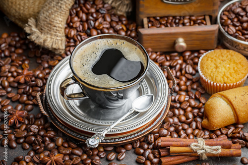 Coffee in a cup and saucer on an old background.