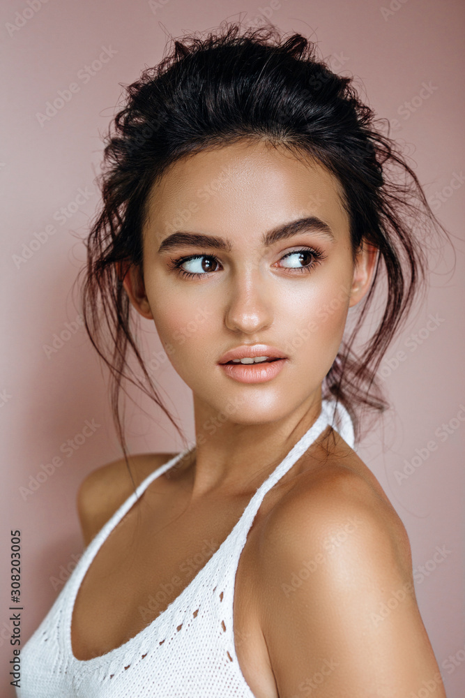 portrait of beautiful model on a pink background in the studio portrait of beautiful model on a pink background in the studio