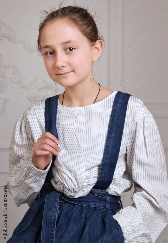 Portrait of little brunette caucasian girl in casual clothes