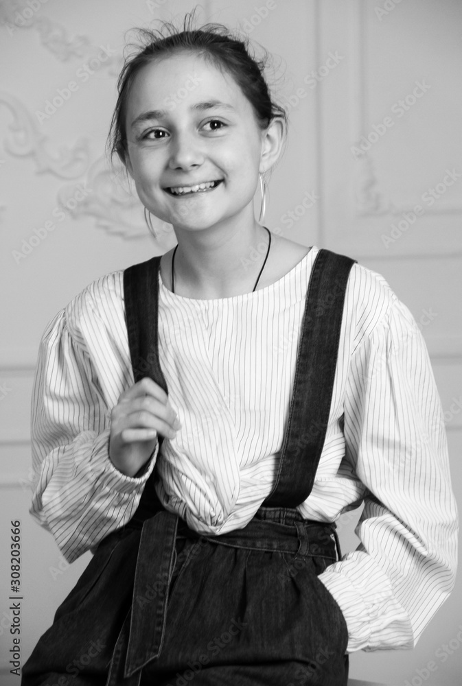 Portrait of little brunette caucasian girl in casual clothes