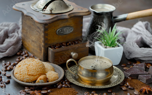 Coffee in a cup on a background of coffee beans, on an old background.