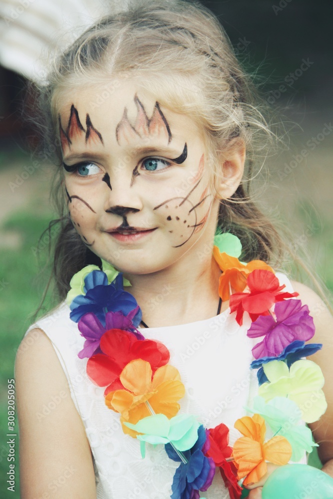 Portrait of little caucasian girl with bright fairy charachter make up