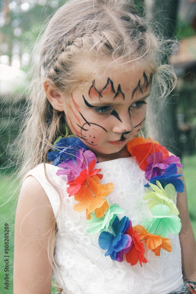 Portrait of little caucasian girl with bright fairy charachter make up