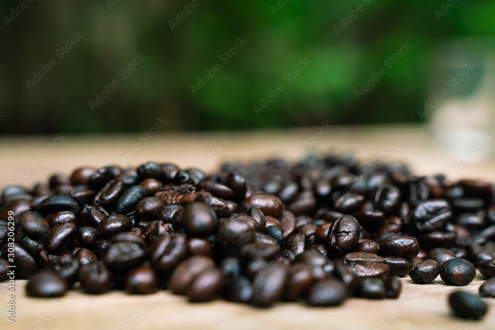 Coffee bean roasted on wooden background Coffee bean roasted on wooden background