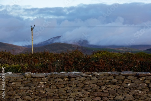 Mist hangs over Mount Brandon and surrounding hills on a damp morning along the Wild Atlantic Way