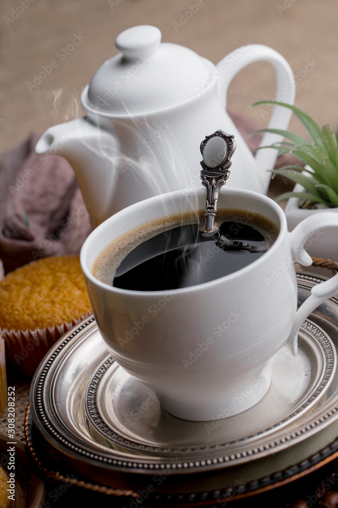 Black coffee on an old background in a cup Black coffee on an old background in a cup