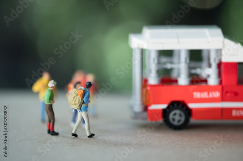 Miniature passenger travel by red mini truck taxi