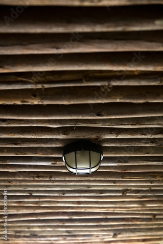Old lamp on the wooden ceil...