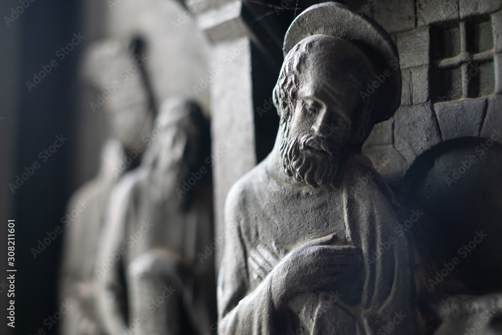 Statues of Christian saints and Jesus in prayer in a Christian church Statues of Christian saints and Jesus in prayer in a Christian church