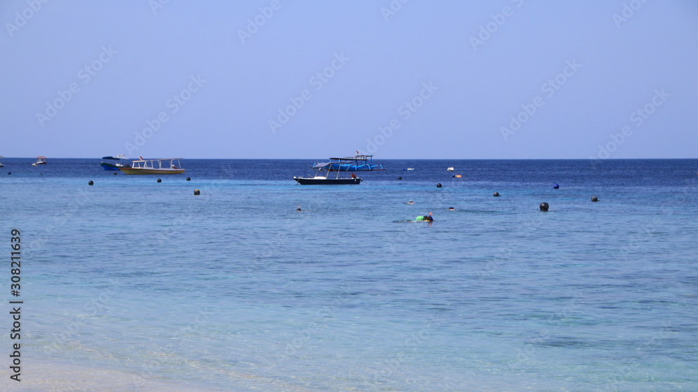 Tourists from various countries enjoy the atmosphere of the Gili Trawangan beach in Lombok Indonesia, 28 November 2019