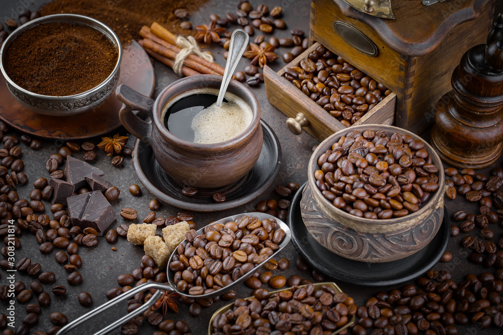 Coffee in a cup and saucer on an old background.