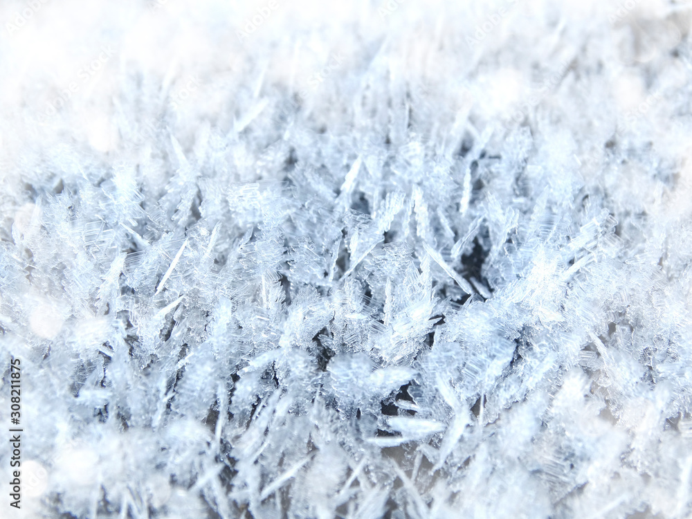 winter background with snowflakes crystals patterns and snow on frozen grass winter background with snowflakes crystals patterns and snow on frozen grass