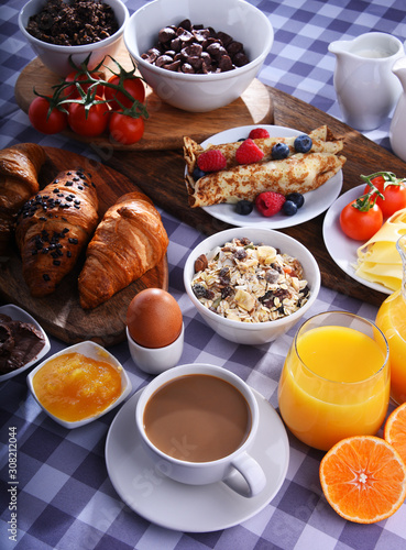 Breakfast served with coffee, juice, croissants and fruits