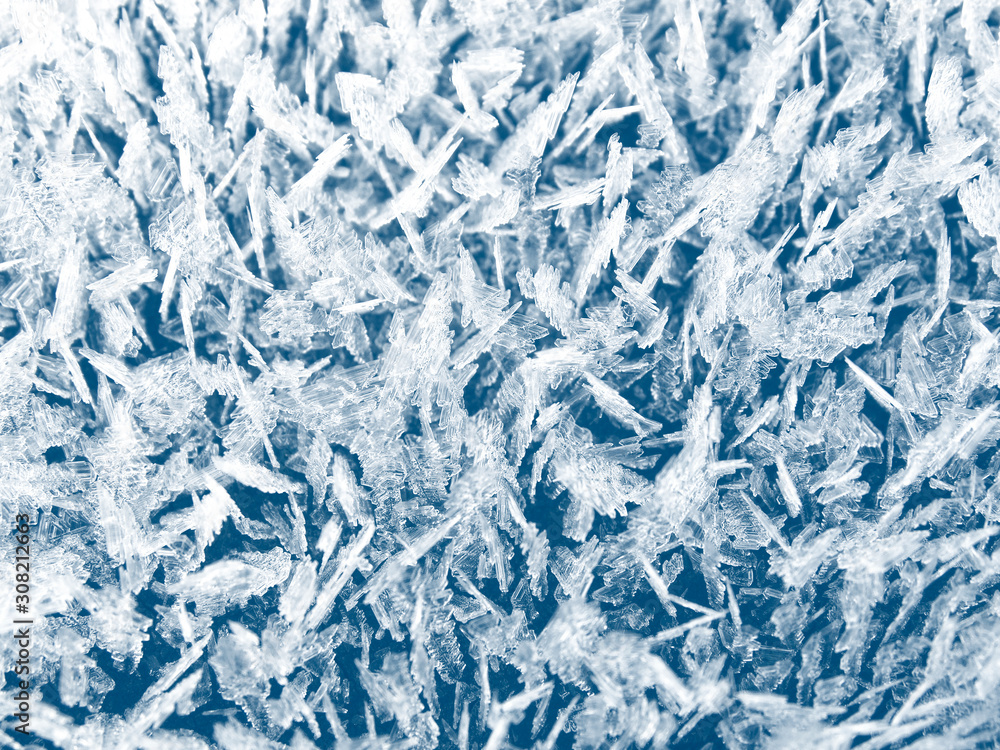 winter background with snowflakes crystals patterns and snow on frozen grass winter background with snowflakes crystals patterns and snow on frozen grass