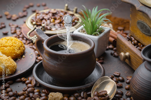 Coffee in a cup on a background of coffee beans  on an old background.