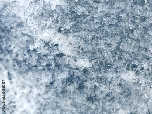 winter background with snowflakes crystals patterns and snow on frozen grass © Anastasia Tsarskaya