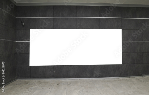 Empty blank widescreen billboard mock up with white screen, alpha channel. Blank frame on airport hall, big banner for marketing.  