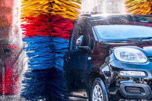 Car going through an automated car wash machine