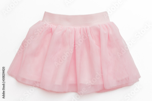Tulle pink skirt for toddler girl on white background/ Top view/ Baby clothes 