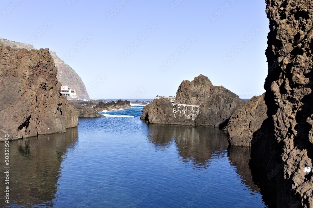 Natural pools with volcanic rock in Porto Moniz, a small town on the Atlantic coast (Madeira, Portugal, Europe)