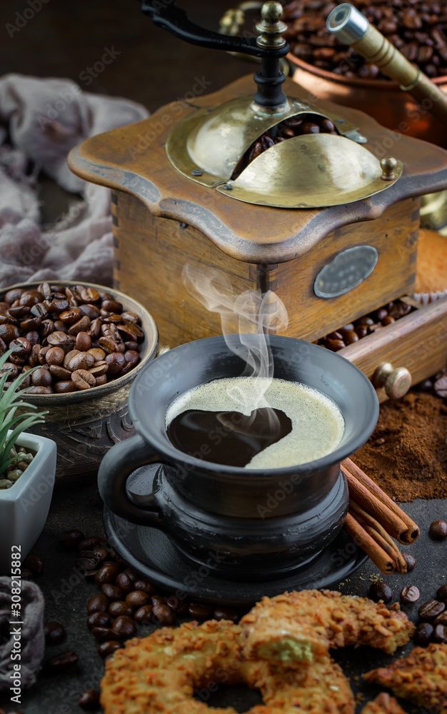 Coffee in a cup and saucer on an old background. Coffee in a cup and saucer on an old background.
